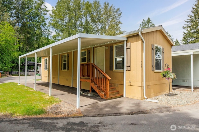 23708 Locust Way Unit 26B, Bothell, WA 98021 - view of front of house with a carport