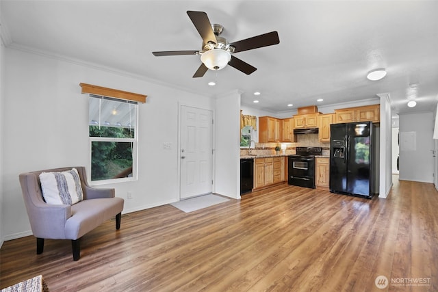 23708 Locust Way Unit 26B, Bothell, WA 98021 - kitchen with black appliances, light wood-style floors, crown molding, tasteful backsplash, and ceiling fan