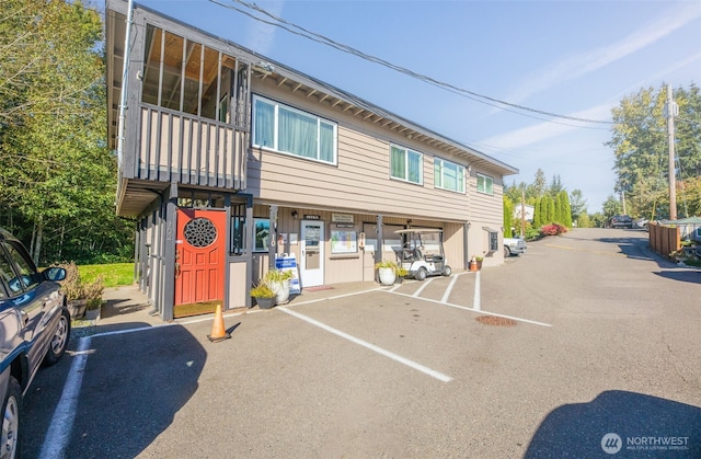 23708 Locust Way Unit 26B, Bothell, WA 98021 - view of building exterior featuring uncovered parking