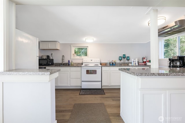 23708 Locust Way Unit 26B, Bothell, WA 98021 - kitchen featuring white range with electric stovetop, wood finished floors, black microwave, and light stone counters