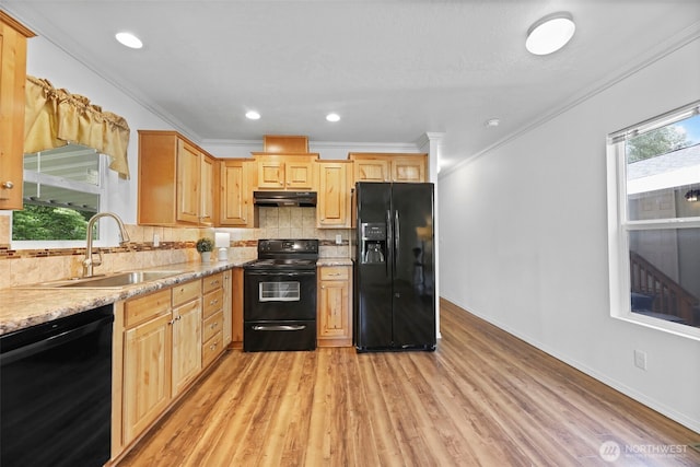 23708 Locust Way Unit 26B, Bothell, WA 98021 - kitchen featuring black appliances, under cabinet range hood, a sink, light wood-style flooring, and tasteful backsplash