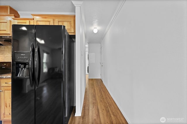 23708 Locust Way Unit 26B, Bothell, WA 98021 - kitchen featuring black fridge, light brown cabinetry, under cabinet range hood, wood finished floors, and ornamental molding