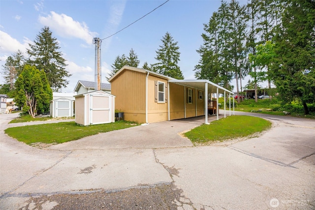 23708 Locust Way Unit 26B, Bothell, WA 98021 - view of front of home with asphalt driveway, a front lawn, and a carport