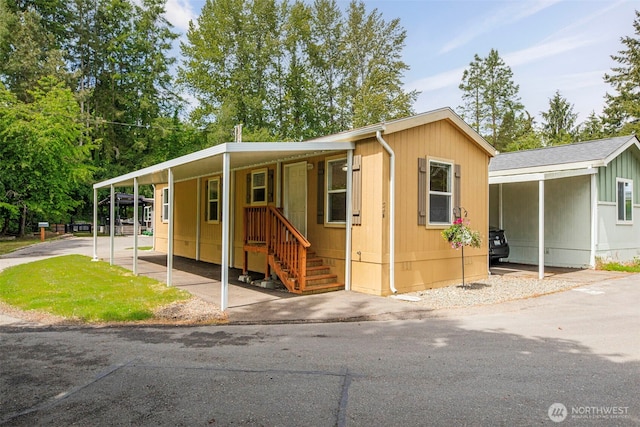 23708 Locust Way Unit 26B, Bothell, WA 98021 - manufactured / mobile home featuring a carport and driveway