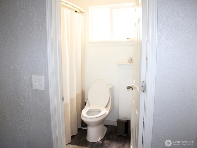 9020 Corbin Dr, Everett, WA 98204 - full bathroom with toilet, wood finished floors, and a textured wall