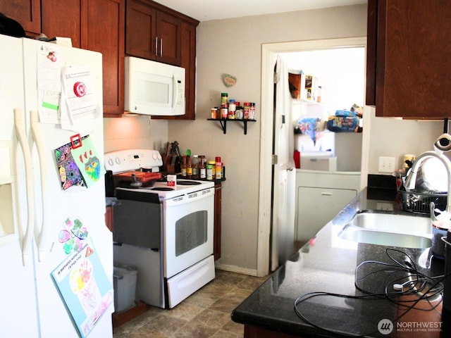 9020 Corbin Dr, Everett, WA 98204 - kitchen featuring white appliances, a sink, and dark countertops