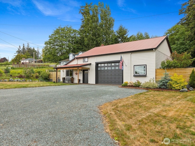 957 SW Camano Dr, Camano Island, WA 98282 - view of front of property featuring driveway, a garage, and metal roof