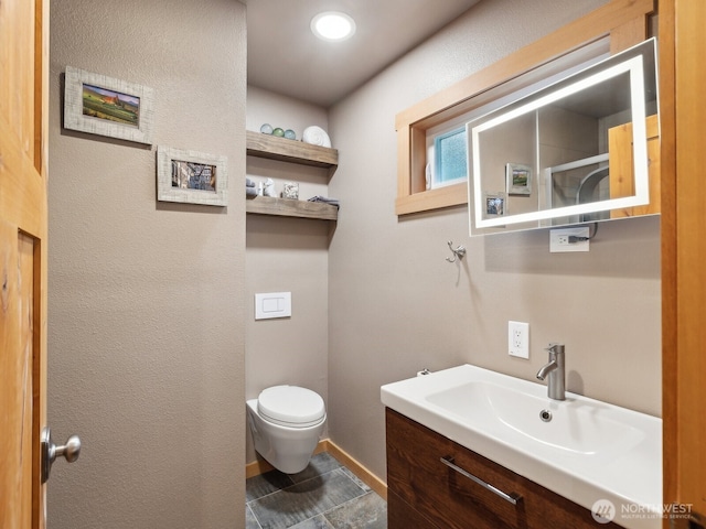 957 SW Camano Dr, Camano Island, WA 98282 - bathroom with toilet, vanity, and baseboards