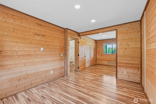 7391 E Grandview St, Port Orchard, WA 98366 - spare room featuring wooden walls, light wood-type flooring, baseboard heating, and recessed lighting