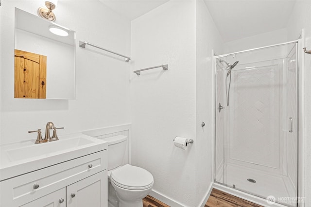 7391 E Grandview St, Port Orchard, WA 98366 - full bathroom featuring wood finished floors, toilet, vanity, and a stall shower