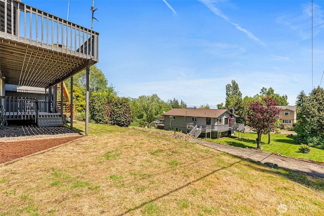 7391 E Grandview St, Port Orchard, WA 98366 - view of green lawn featuring stairs and a wooden deck