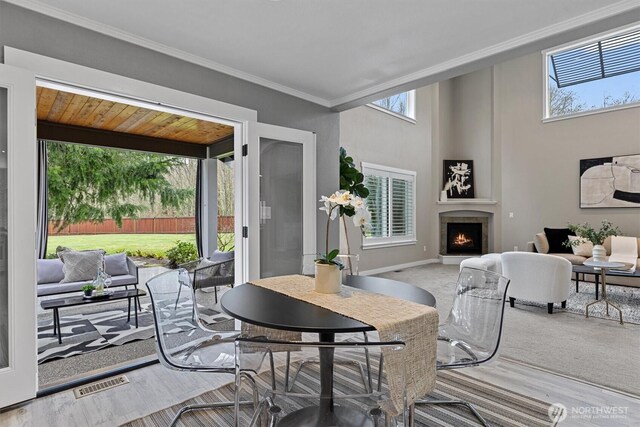 31632 19th Dr NW, Stanwood, WA 98292 - carpeted living area with a warm lit fireplace and crown molding