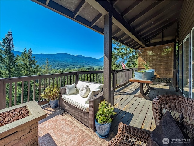 239 Alpine Dr, Packwood, WA 98361 - deck featuring a mountain view and an outdoor living space with a fire pit