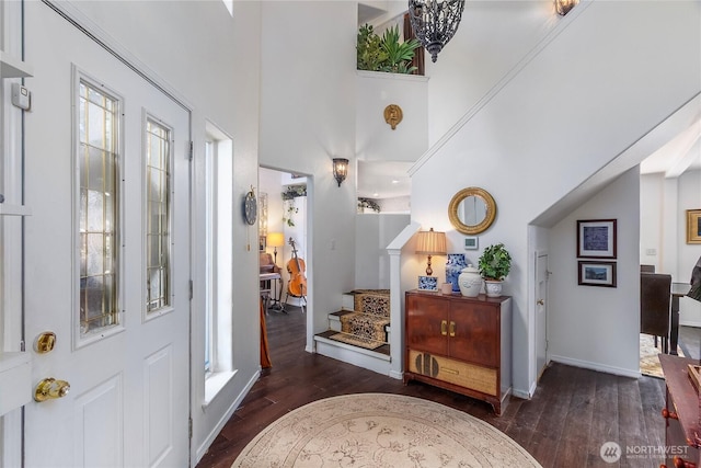 239 Alpine Dr, Packwood, WA 98361 - foyer entrance featuring dark wood-style flooring, stairs, and baseboards