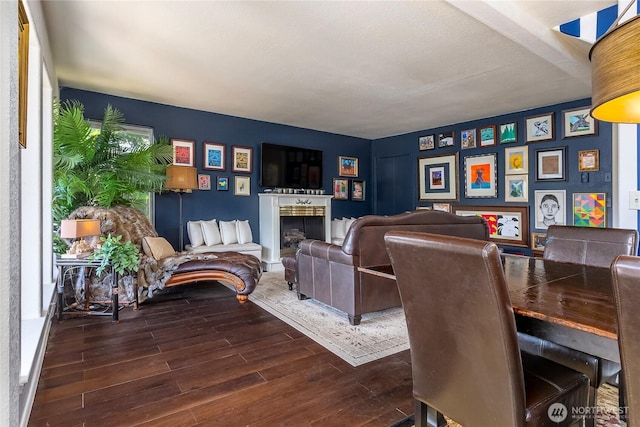 239 Alpine Dr, Packwood, WA 98361 - dining room featuring wood finished floors and a fireplace