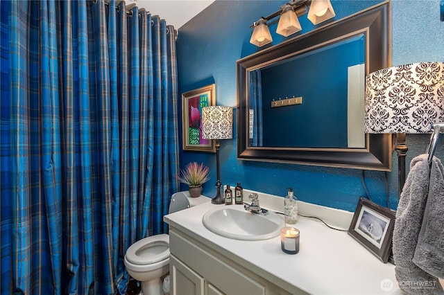 239 Alpine Dr, Packwood, WA 98361 - bathroom with vanity, toilet, a textured wall, and a shower with curtain