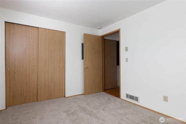 730 SE 8th Ave Unit B101, Oak Harbor, WA 98277 - unfurnished bedroom featuring a closet and carpet