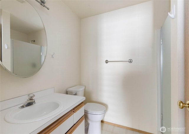 730 SE 8th Ave Unit B101, Oak Harbor, WA 98277 - bathroom with vanity, toilet, and baseboards