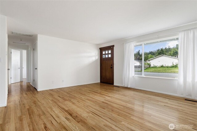 1020 SW Bowmer St, Oak Harbor, WA 98277 - foyer featuring light wood-style flooring and baseboards
