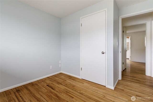 1020 SW Bowmer St, Oak Harbor, WA 98277 - unfurnished bedroom featuring light wood finished floors and baseboards