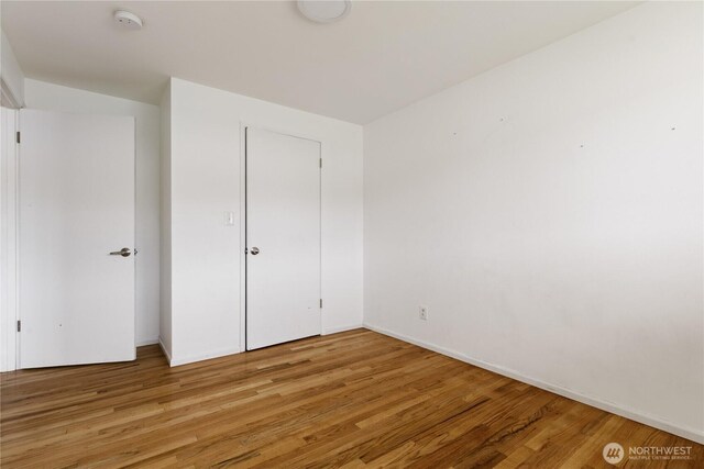 1020 SW Bowmer St, Oak Harbor, WA 98277 - unfurnished bedroom featuring light wood finished floors and baseboards