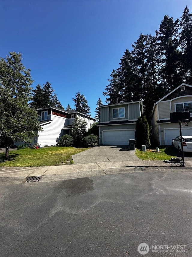 9614 191st Street Ct E, Puyallup, WA 98375 - traditional home featuring an attached garage, concrete driveway, and a front lawn
