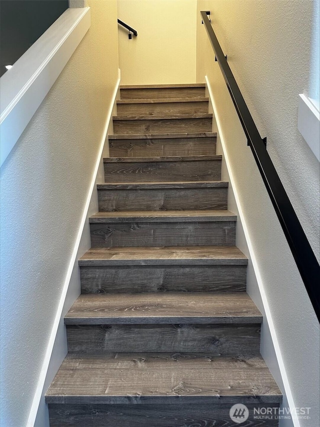 9614 191st Street Ct E, Puyallup, WA 98375 - staircase with a textured wall and wood finished floors