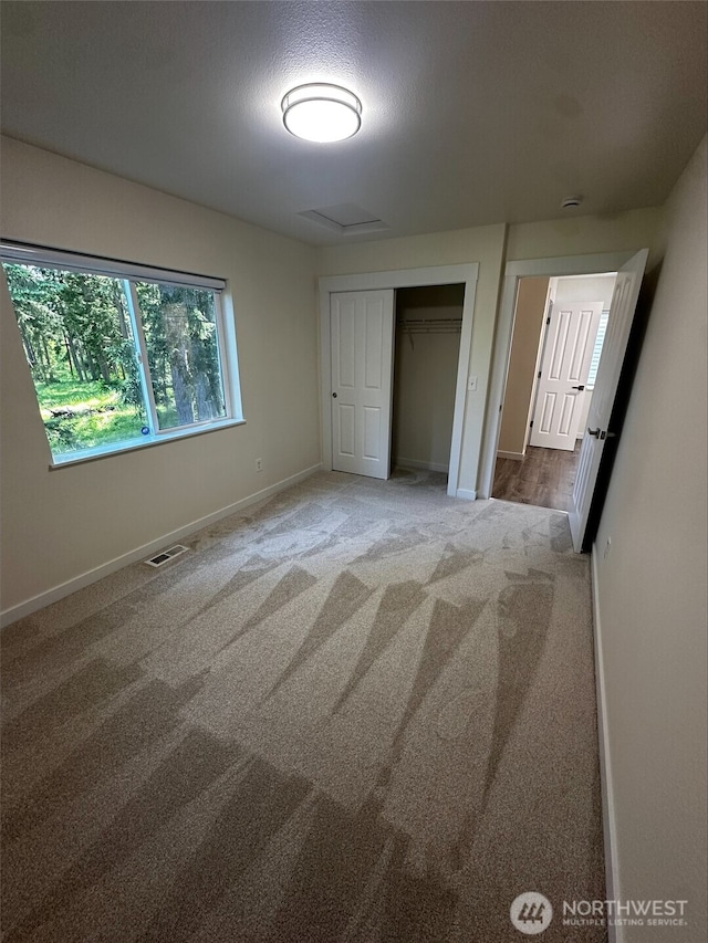 9614 191st Street Ct E, Puyallup, WA 98375 - unfurnished bedroom featuring carpet, baseboards, and a closet