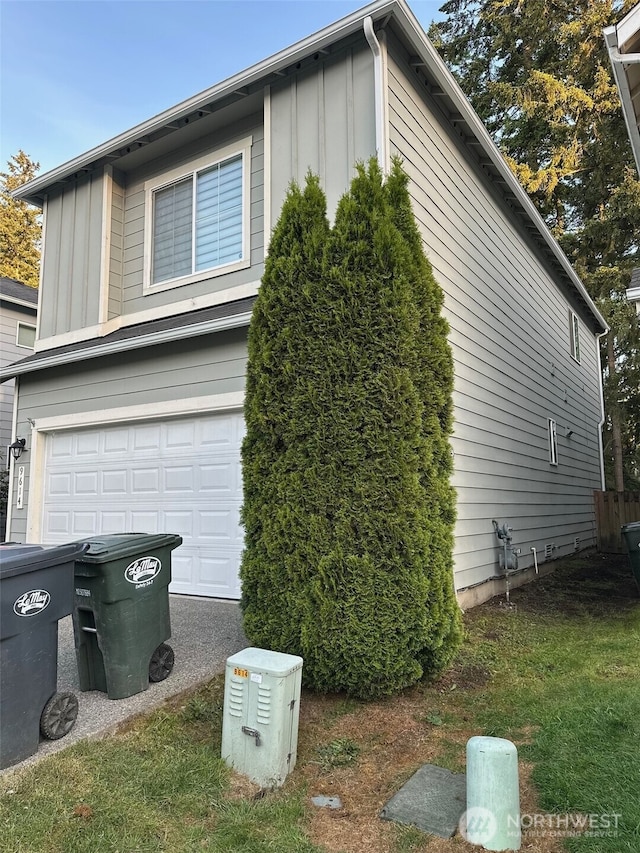 9614 191st Street Ct E, Puyallup, WA 98375 - view of home's exterior featuring board and batten siding and an attached garage