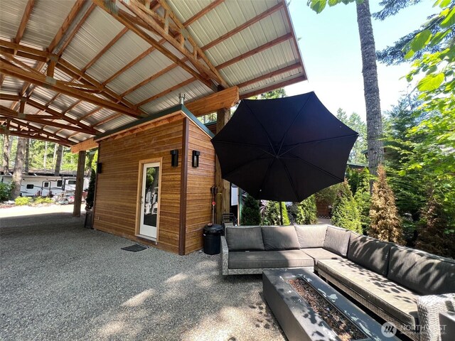 1546 Reservation Rd SE # 191, Olympia, WA 98513 - view of patio / terrace with an outdoor living space with a fire pit