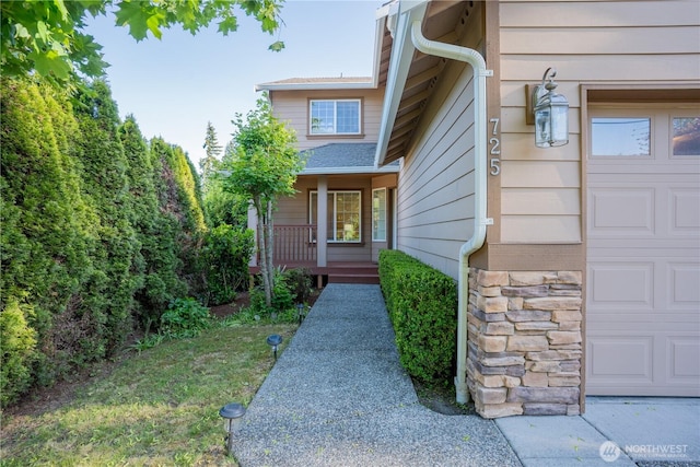 725 N 198th St, Shoreline, WA 98133 - entrance to property with stone siding, covered porch, and an attached garage