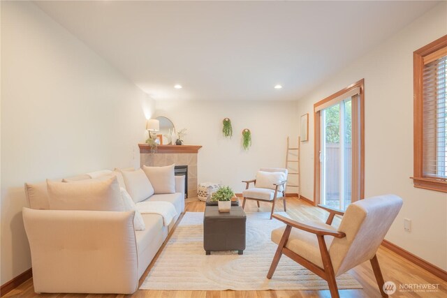 725 N 198th St, Shoreline, WA 98133 - living room featuring light wood-type flooring, a fireplace, recessed lighting, and baseboards