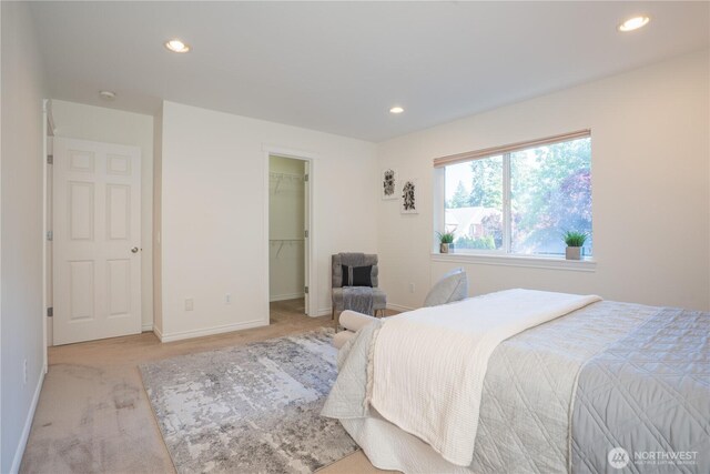 725 N 198th St, Shoreline, WA 98133 - bedroom featuring light colored carpet, recessed lighting, a walk in closet, and baseboards