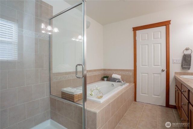 725 N 198th St, Shoreline, WA 98133 - full bathroom featuring a shower stall, a garden tub, vanity, and tile patterned flooring