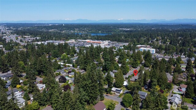 725 N 198th St, Shoreline, WA 98133 - aerial view of property and surrounding area featuring a heavily wooded area