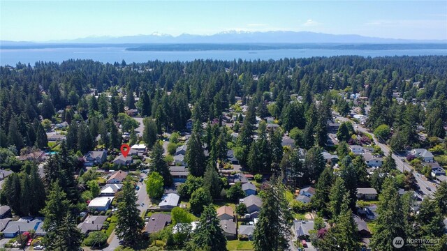 725 N 198th St, Shoreline, WA 98133 - aerial view of property and surrounding area with a forest, a water and mountain view, and nearby suburban area