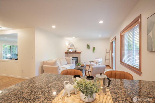 725 N 198th St, Shoreline, WA 98133 - dining area with wood finished floors, a tile fireplace, and recessed lighting