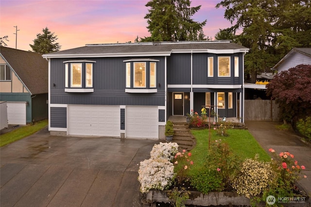 22718 1st Pl W, Bothell, WA 98021 - view of front of house with asphalt driveway, a garage, roof with shingles, and a porch