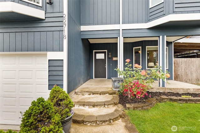 22718 1st Pl W, Bothell, WA 98021 - property entrance featuring a garage, a porch, and board and batten siding