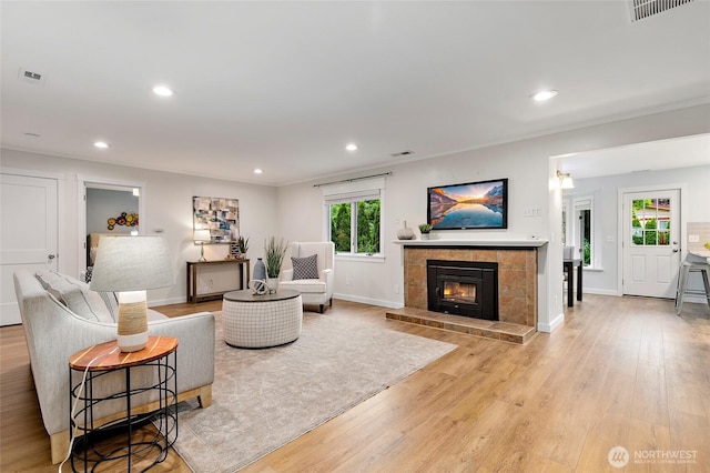 22718 1st Pl W, Bothell, WA 98021 - living room featuring recessed lighting, baseboards, light wood-style floors, and a tile fireplace