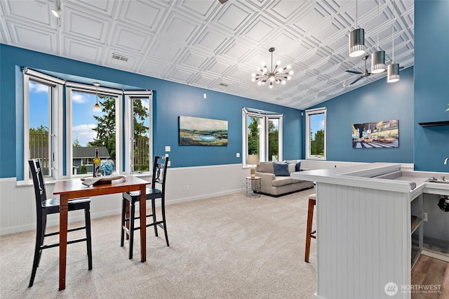 22718 1st Pl W, Bothell, WA 98021 - dining area featuring an ornate ceiling, a chandelier, carpet floors, and a wainscoted wall
