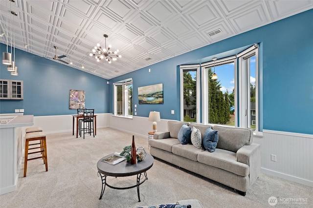 22718 1st Pl W, Bothell, WA 98021 - carpeted living room with a chandelier, wainscoting, vaulted ceiling, and an ornate ceiling