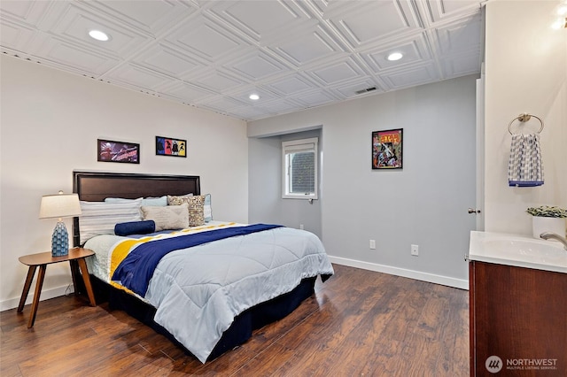 22718 1st Pl W, Bothell, WA 98021 - bedroom with recessed lighting, baseboards, a sink, dark wood-style flooring, and an ornate ceiling