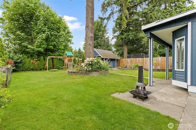 22718 1st Pl W, Bothell, WA 98021 - view of yard featuring an outdoor structure, a patio, and a playground