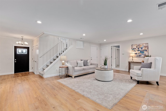 22718 1st Pl W, Bothell, WA 98021 - living room with light wood-type flooring, a chandelier, stairs, recessed lighting, and baseboards