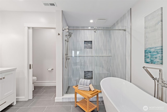 22718 1st Pl W, Bothell, WA 98021 - bathroom featuring a freestanding bath, a shower stall, tile patterned floors, toilet, and recessed lighting