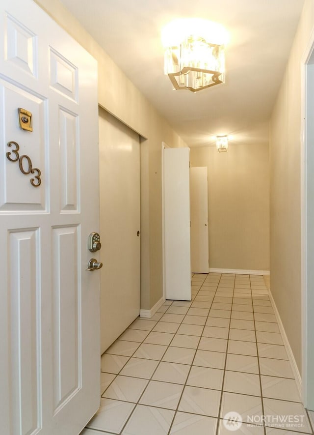 1526 Alki Ave SW Unit 303, Seattle, WA 98116 - hallway with light tile patterned floors and baseboards