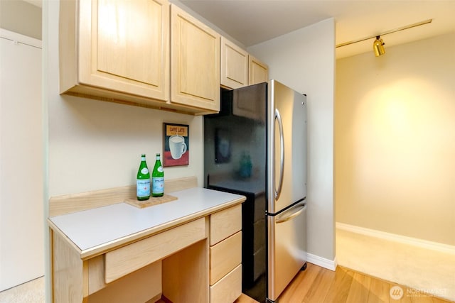 1526 Alki Ave SW Unit 303, Seattle, WA 98116 - kitchen featuring freestanding refrigerator, light brown cabinets, light wood-type flooring, light countertops, and track lighting