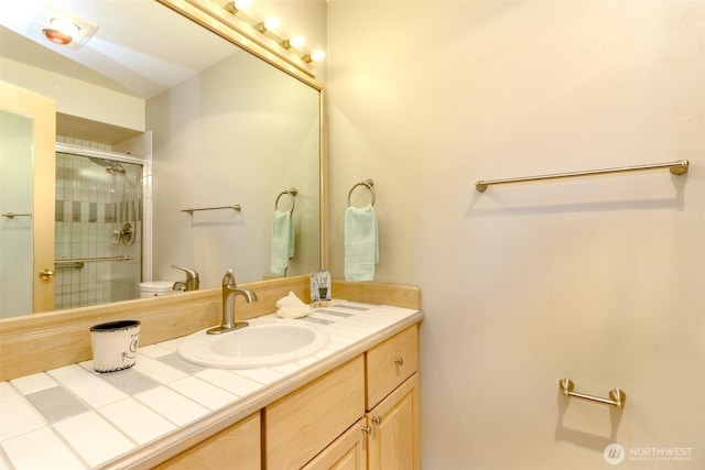 1526 Alki Ave SW Unit 303, Seattle, WA 98116 - bathroom featuring toilet, tiled shower, and vanity