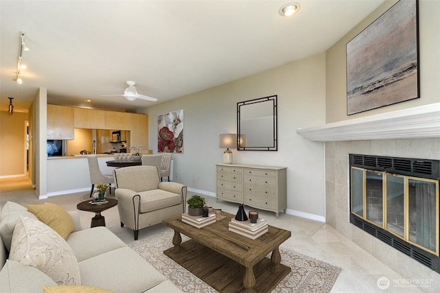 1526 Alki Ave SW Unit 303, Seattle, WA 98116 - living area featuring baseboards, a ceiling fan, a fireplace, rail lighting, and recessed lighting